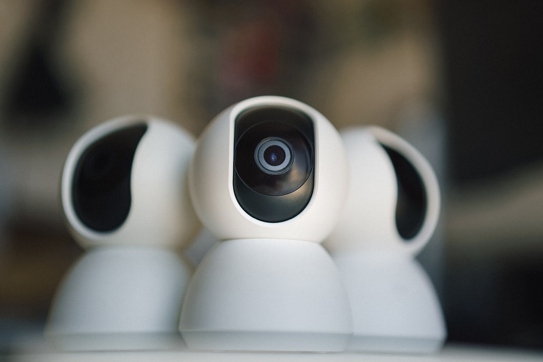 A close up of a camera on top of a table, Webcam security camera. Smart home automation guard system.