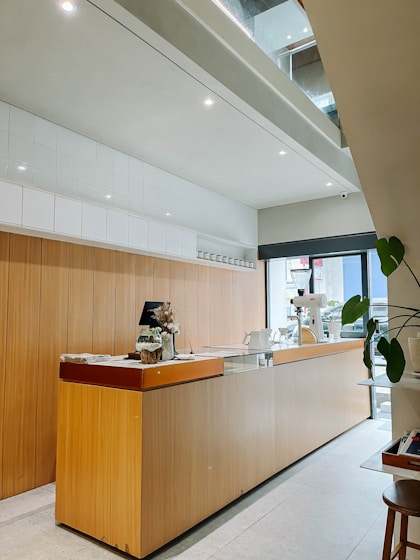 A large wooden counter sitting inside of a kitchen