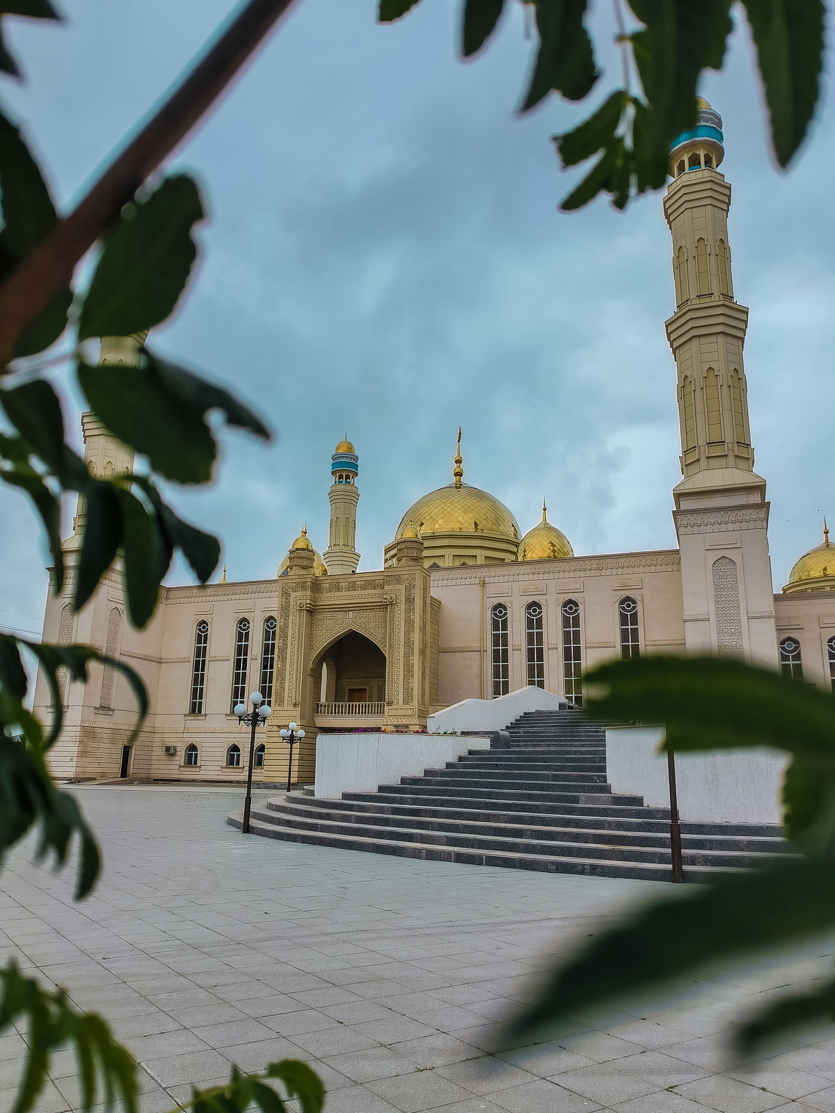 A large building with a yellow dome on top of it