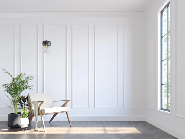 A white room with a chair and a potted plant