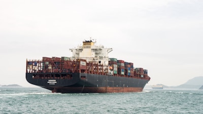 A large cargo ship in the middle of the ocean