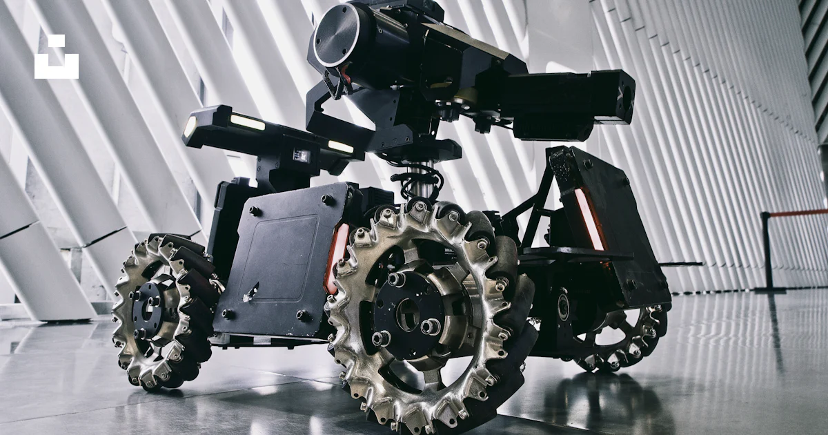 A black and white photo of a camera on wheels photo – Free Machine ...