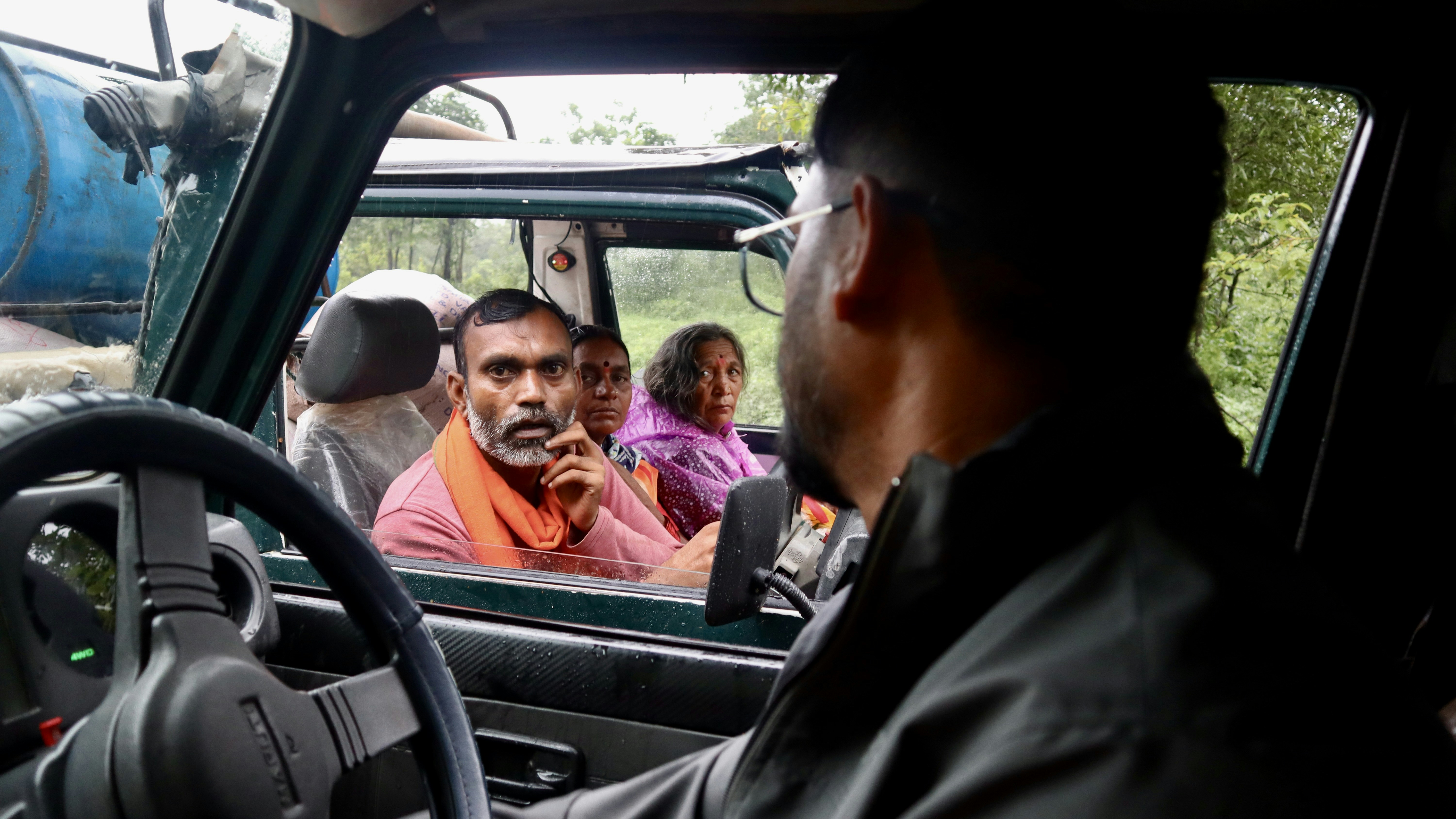 A man driving a truck with a picture of a man on the screen