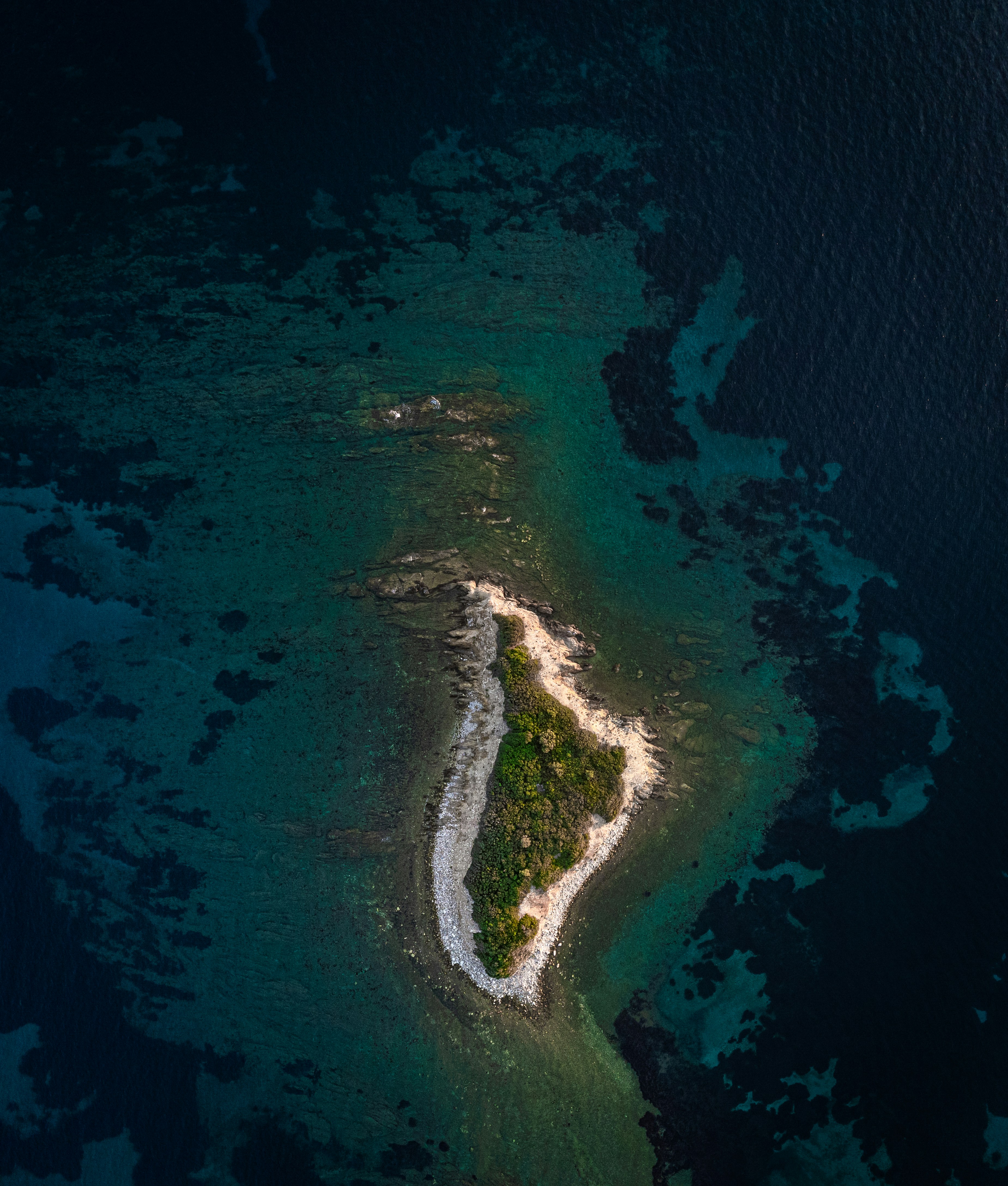 An aerial view of a small island in the middle of the ocean