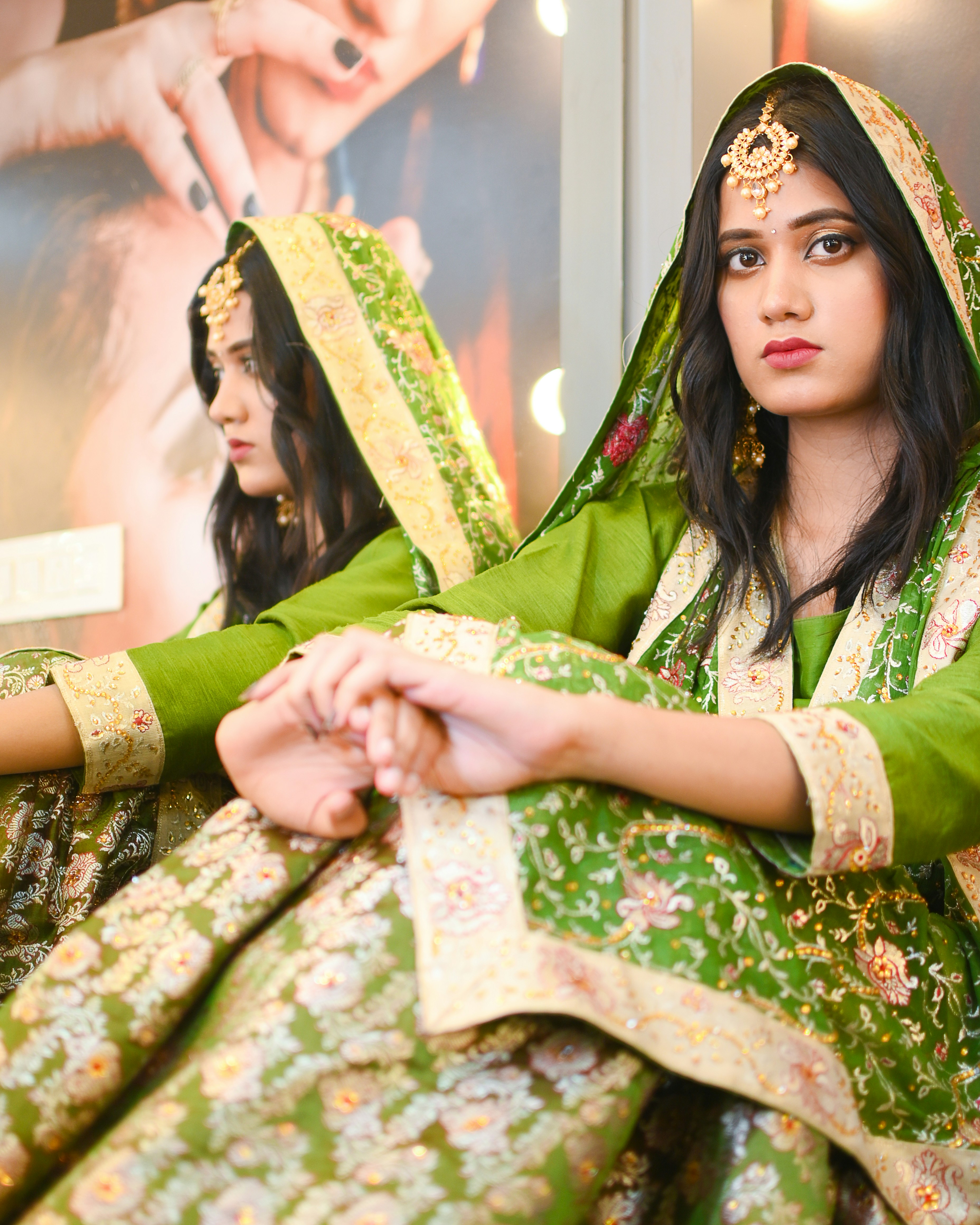 A couple of women sitting next to each other