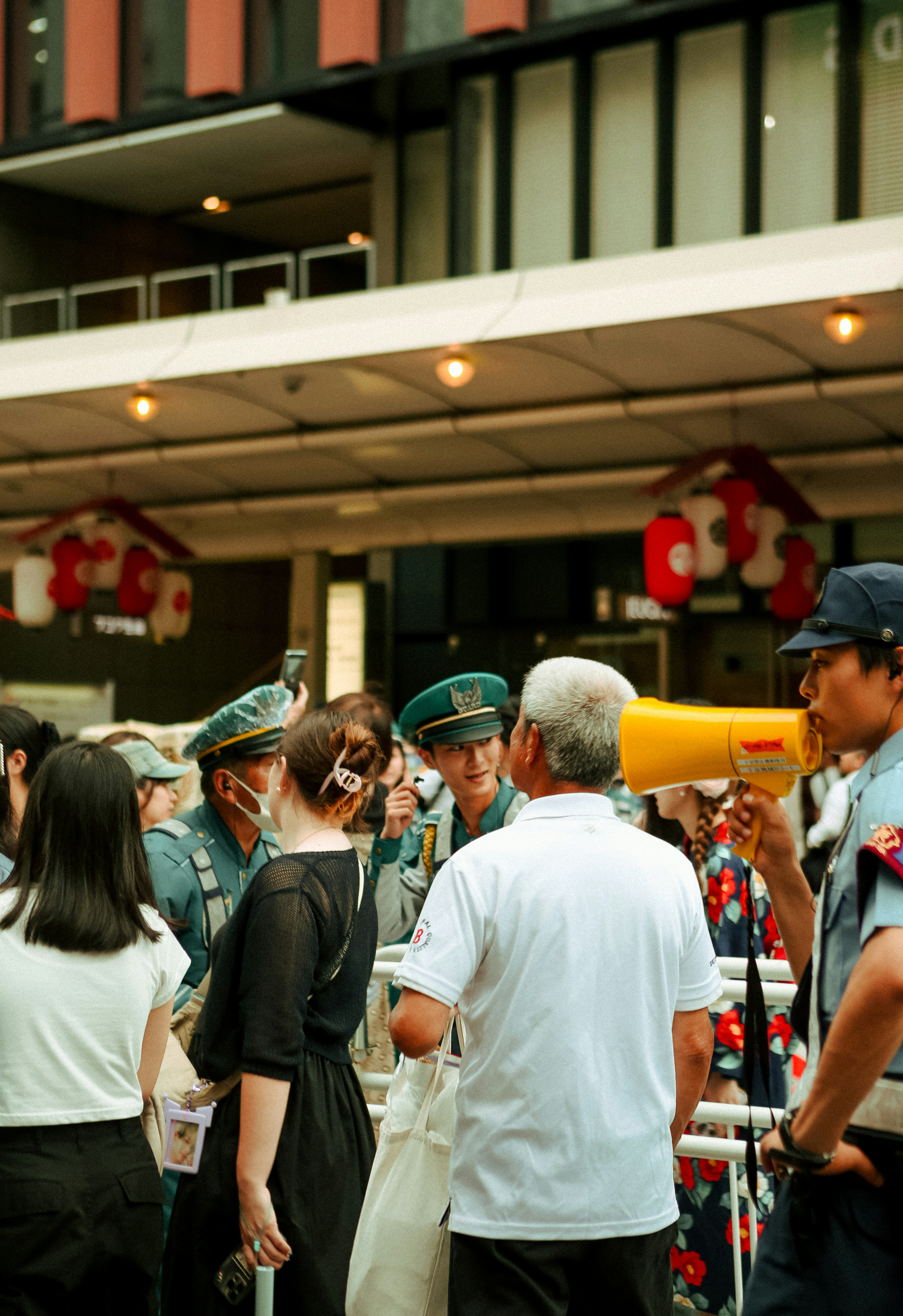 A group of people standing in front of a building