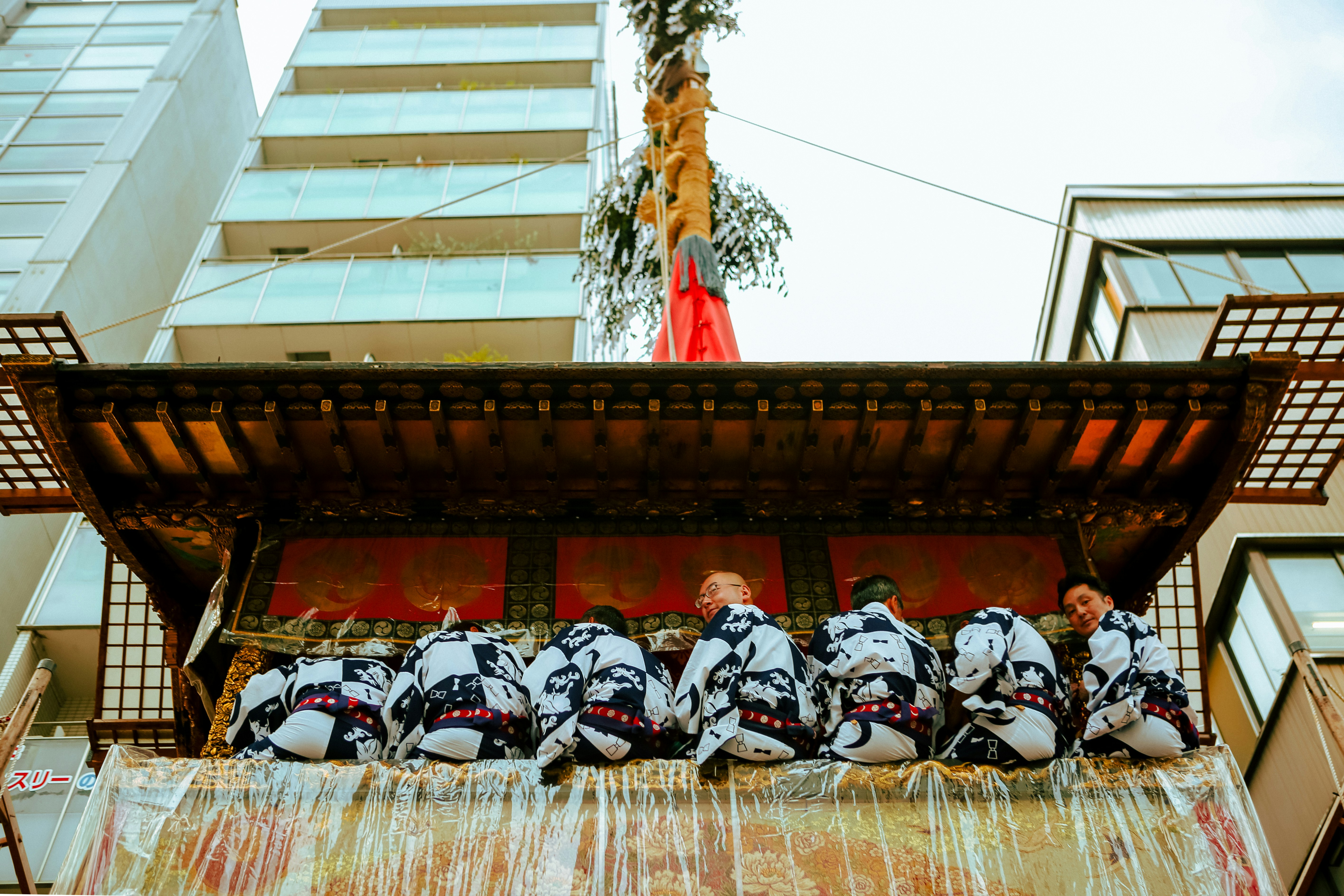 A group of people sitting on top of a building
