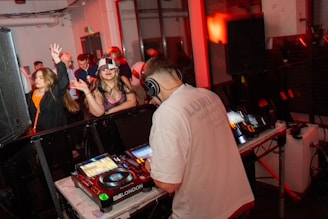 A group of people in a room with djs