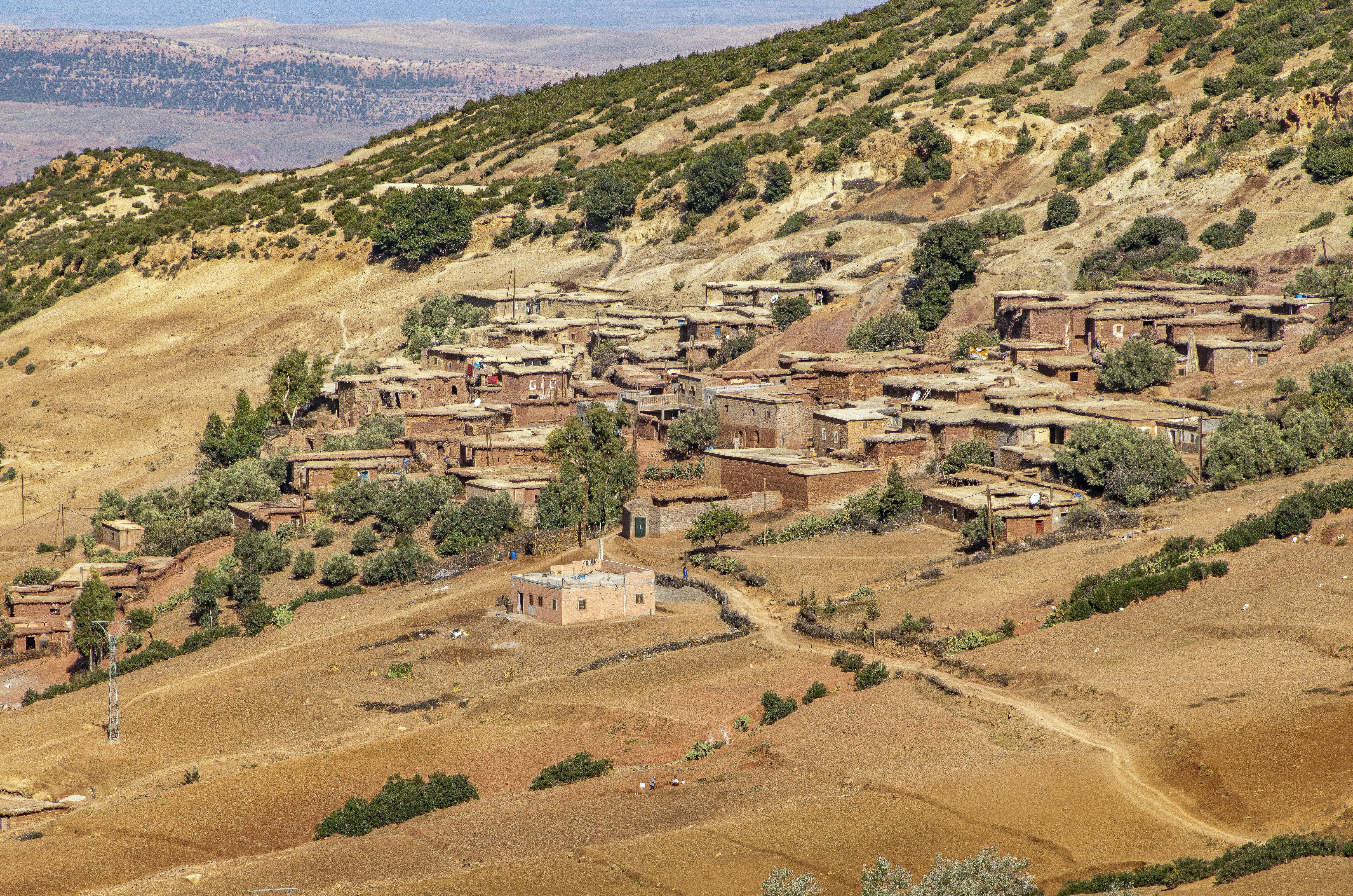 A view of a village in the middle of a mountain