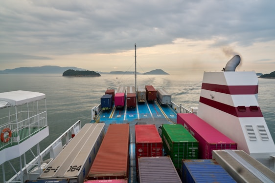 A large boat with lots of containers on it