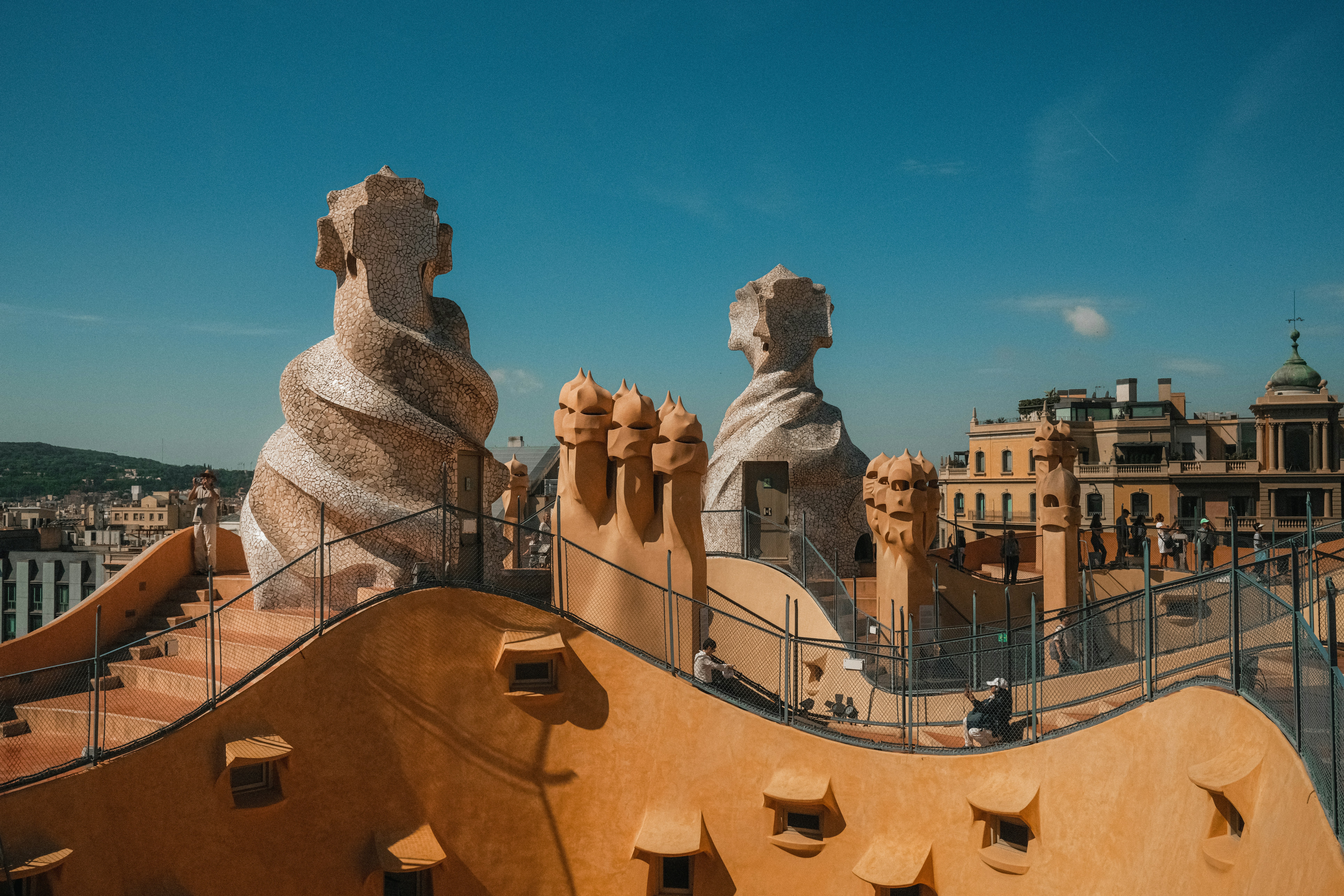 A view of some statues on top of a building