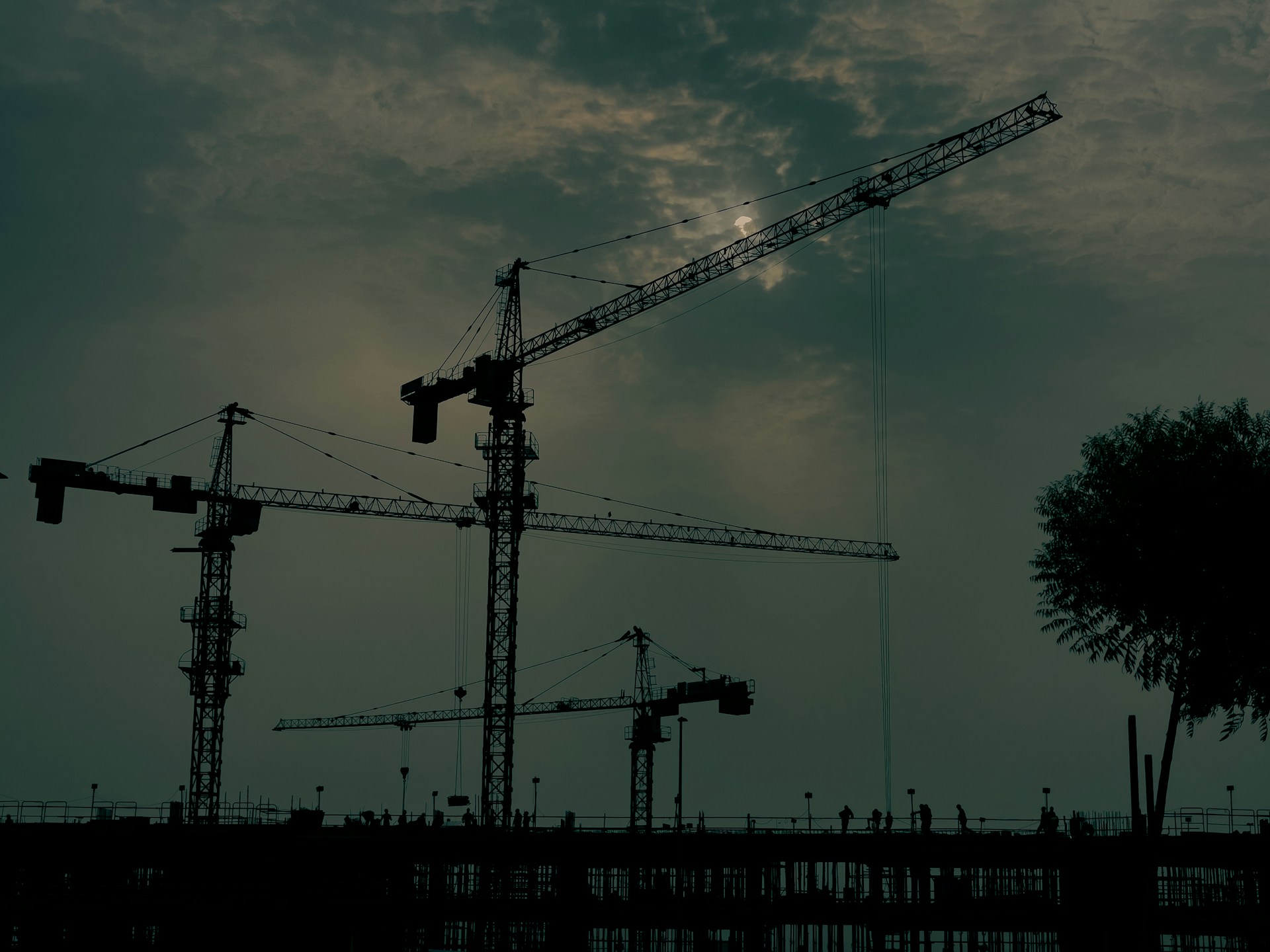 A building under construction with a crane in the background