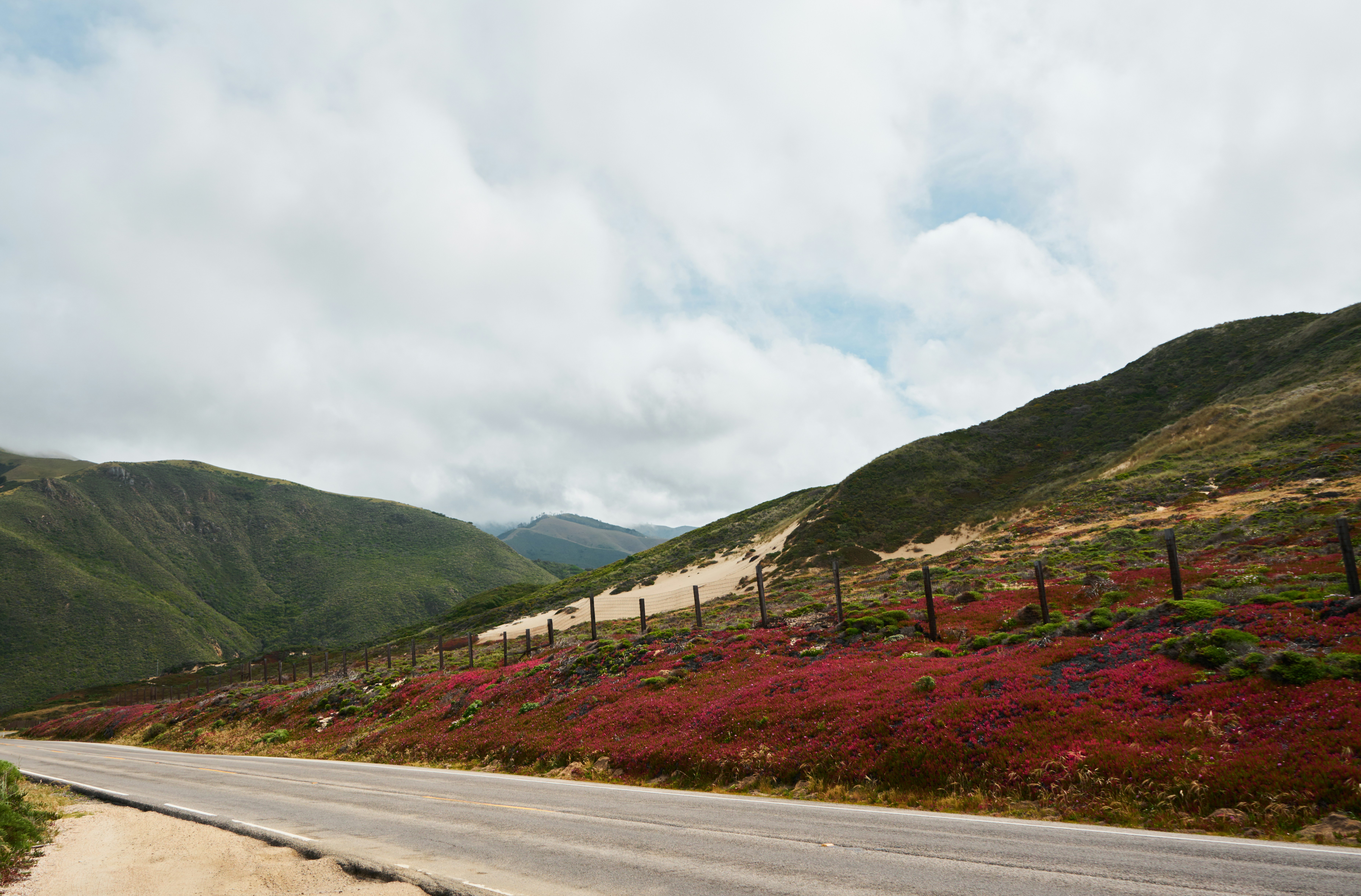A road with a hill in the background