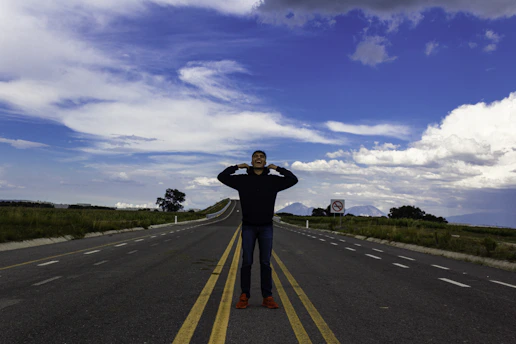 A man standing in the middle of a road
