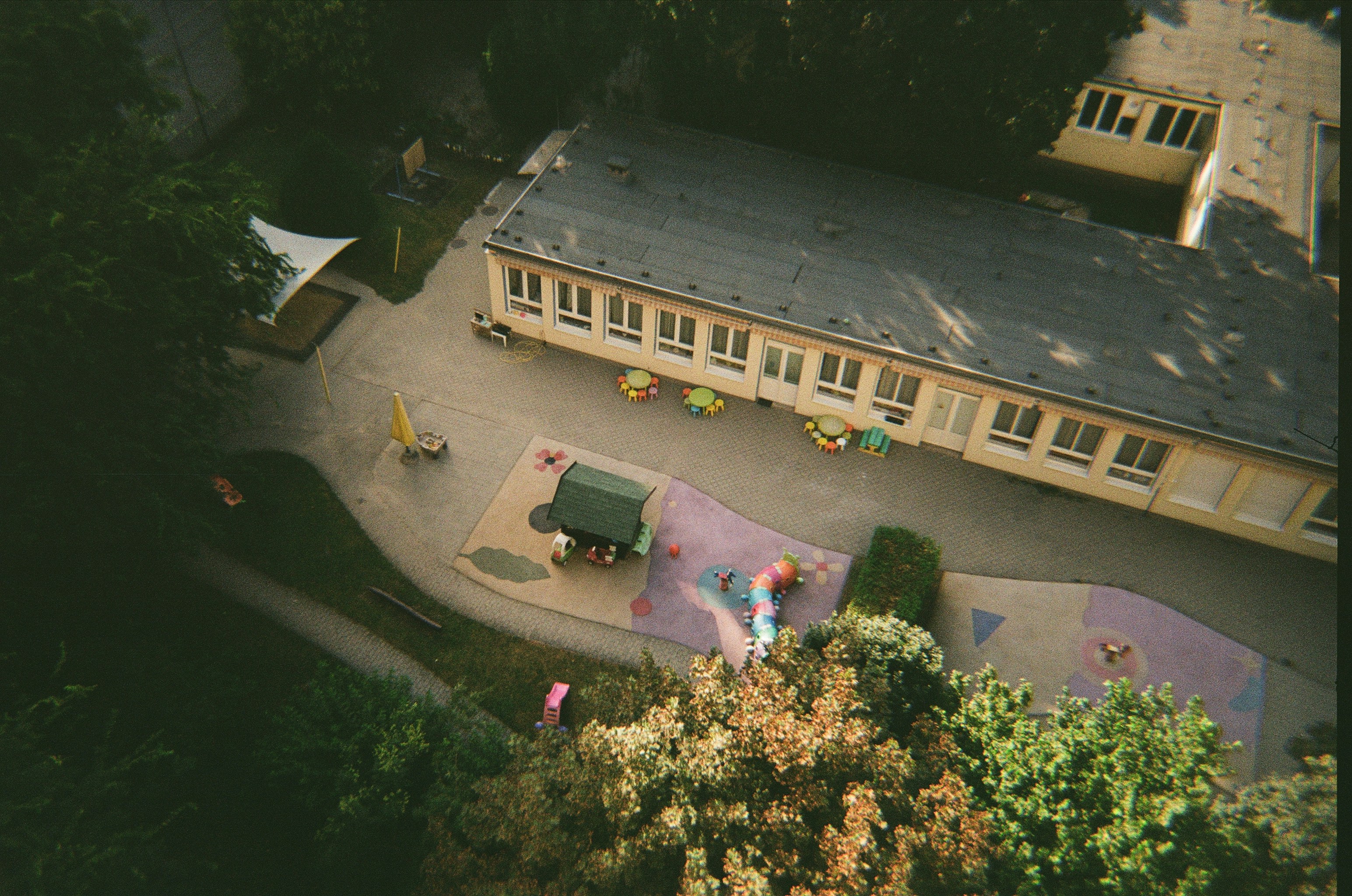 An aerial view of a building with a playground