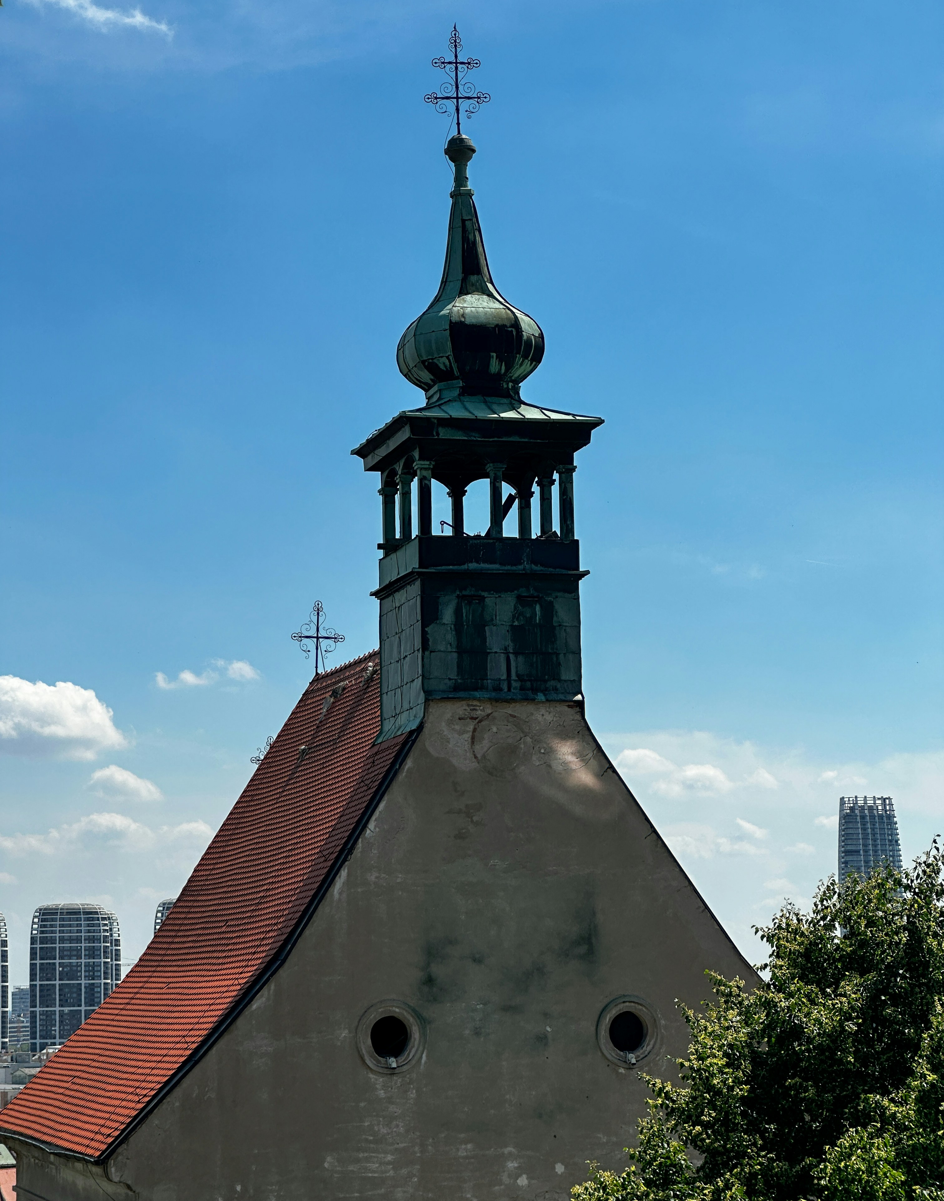 A church steeple with a cross on top