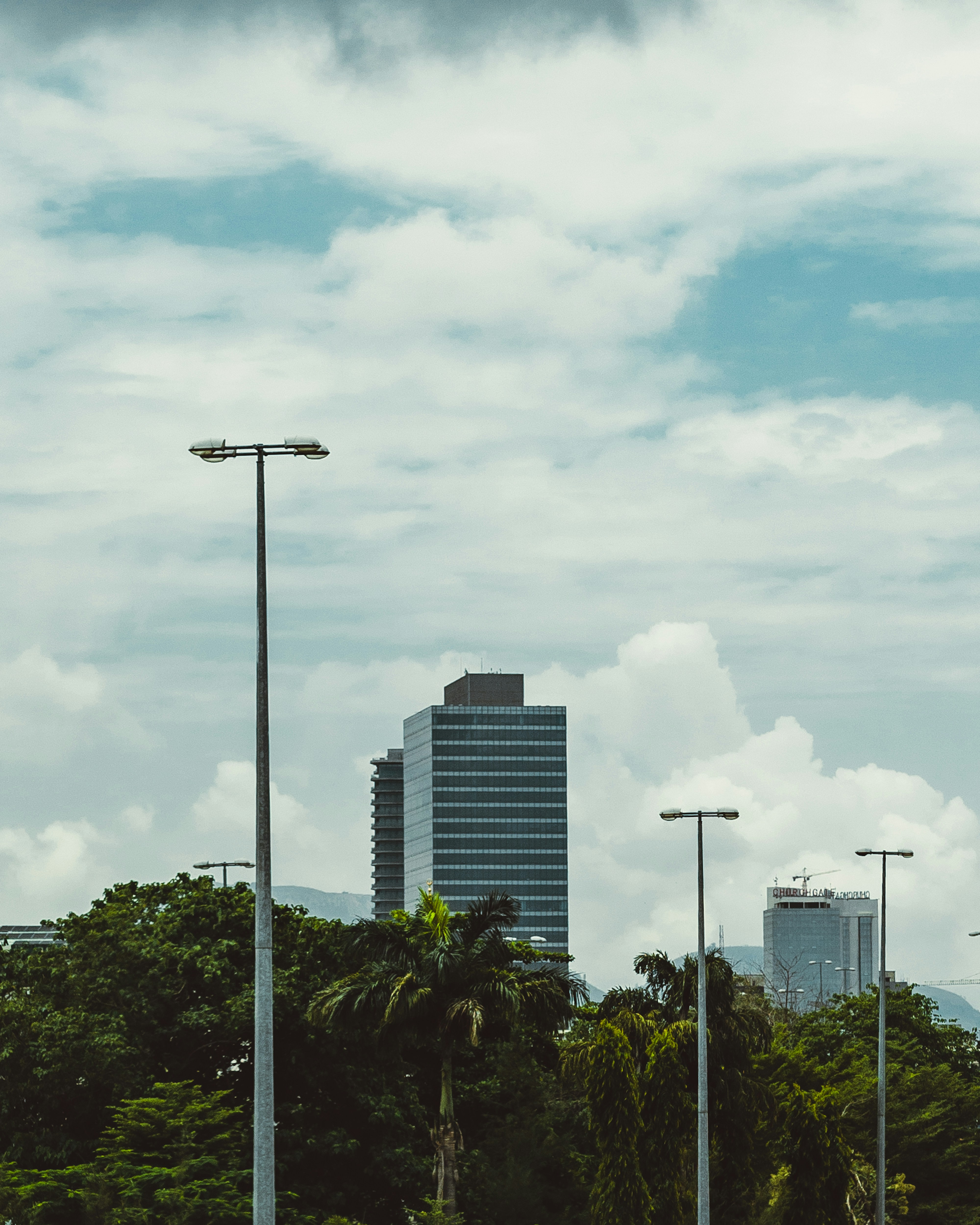 A city street with tall buildings in the background
