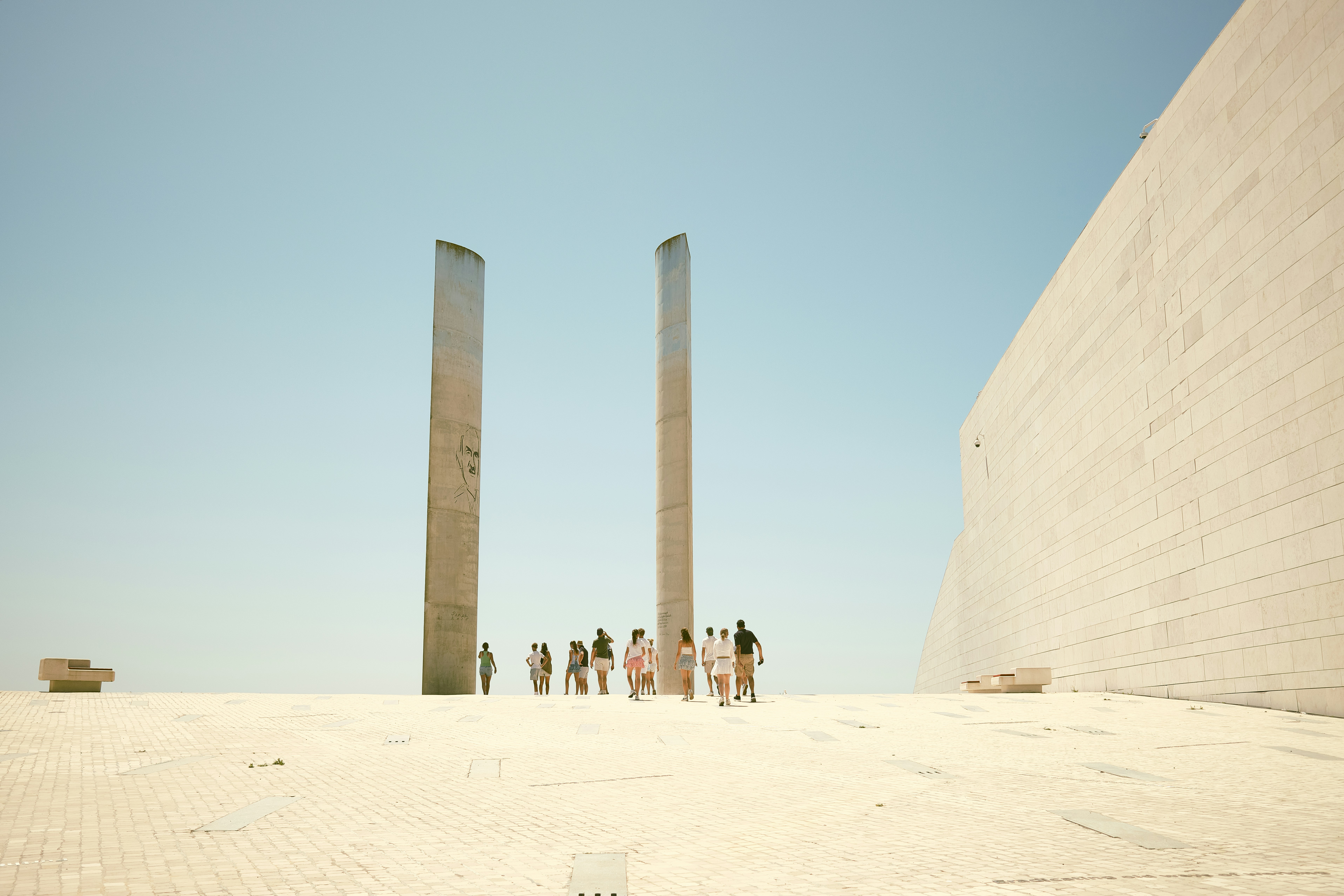 A group of people standing in front of a monument