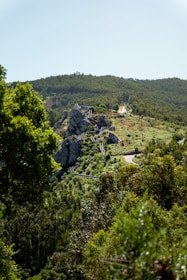 A scenic view of a mountain with a road going through it