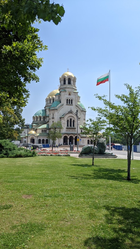 A large building with a flag on top of it