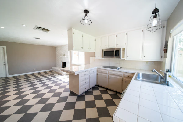 Kitchen and entry tile flooring installed in a family home