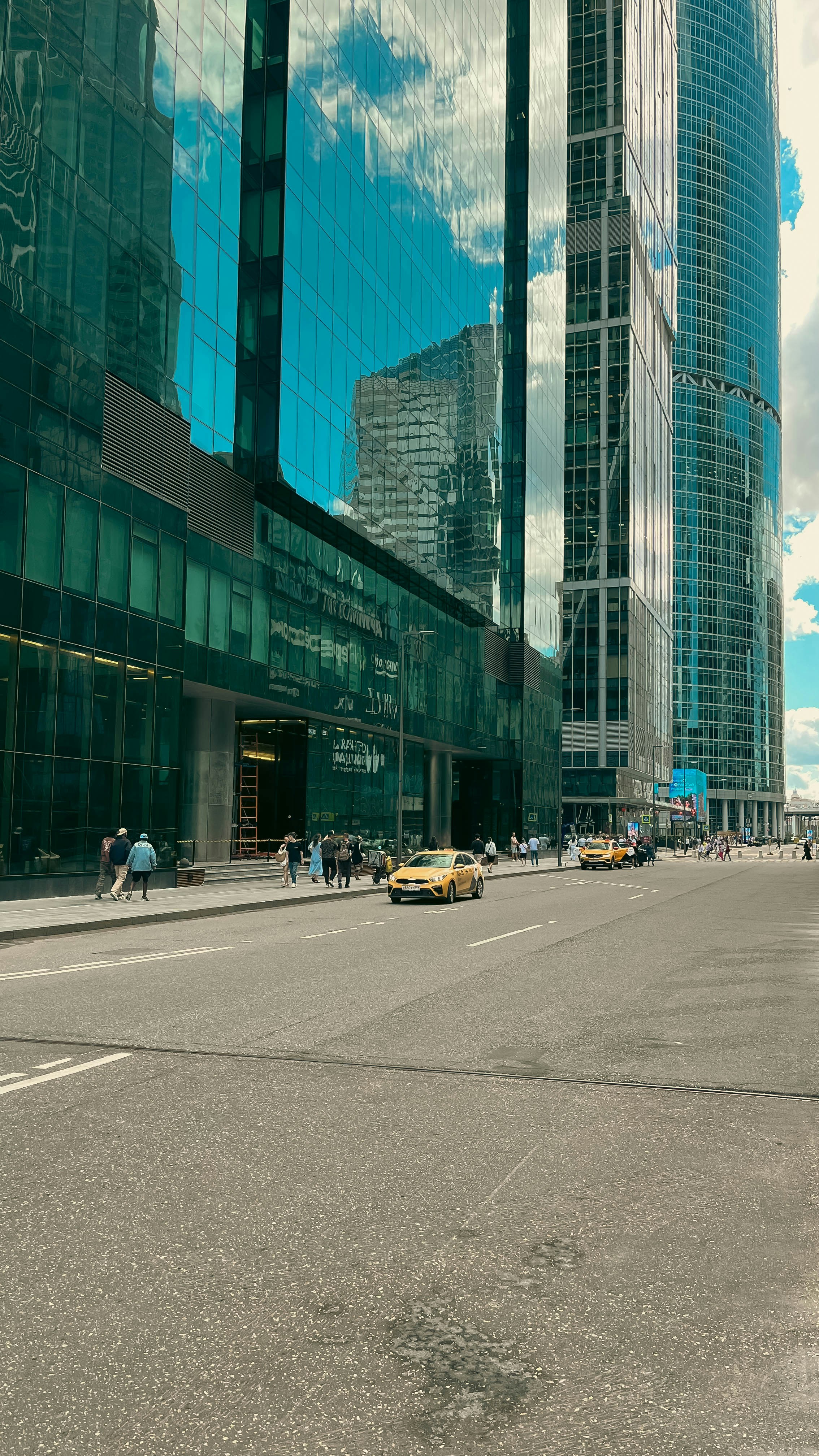 A city street filled with lots of tall buildings photo – Free Street ...