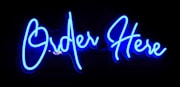 A blue neon sign that says order here