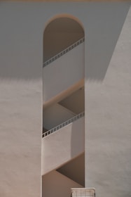 A tall white building with a clock on it's side