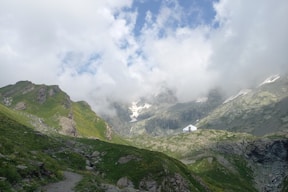 A view of a valley with a mountain in the background