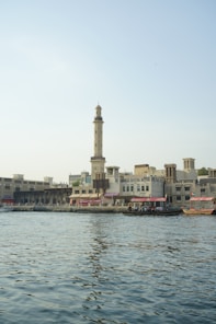 A large body of water with buildings in the background