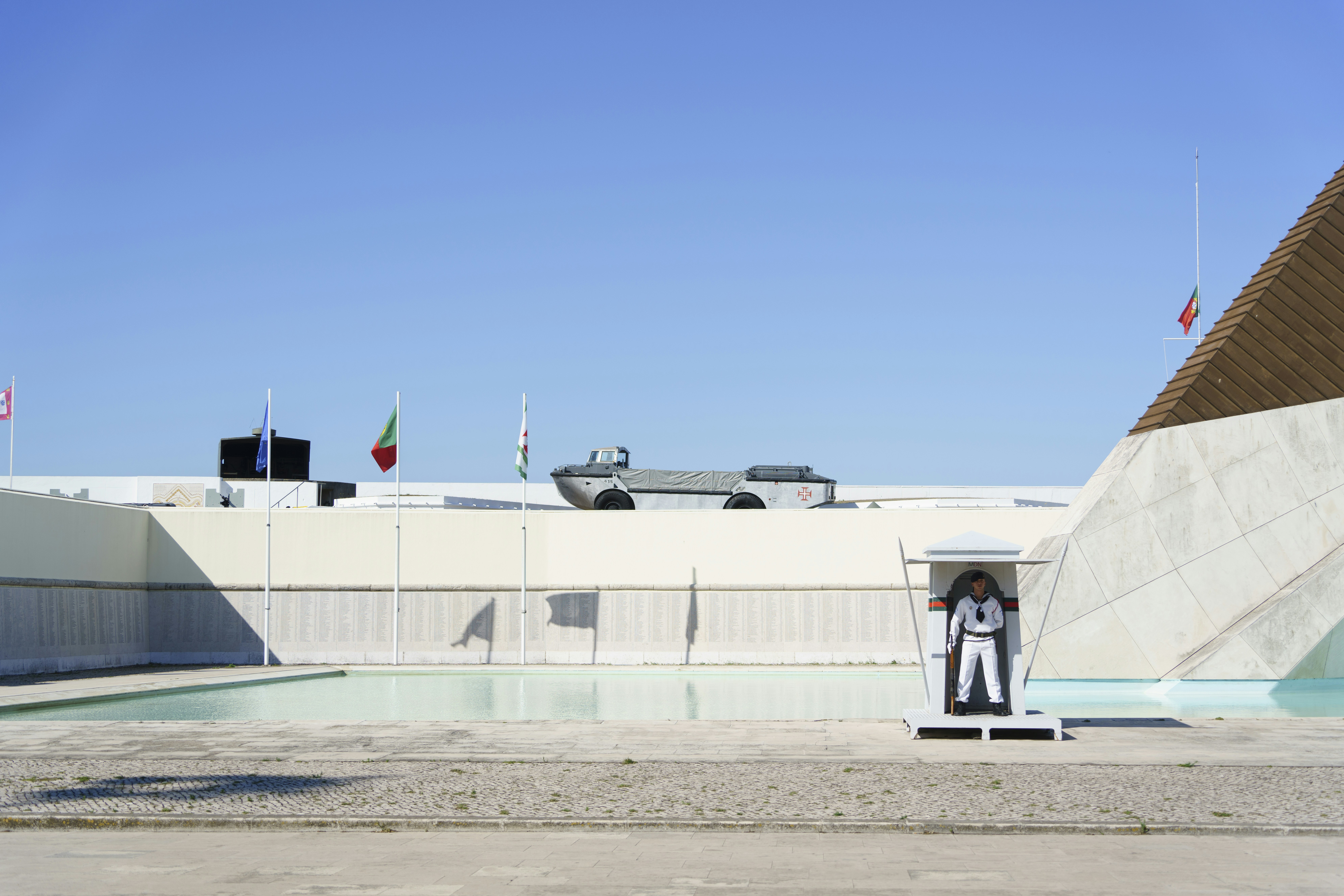 A man standing in front of a pool of water