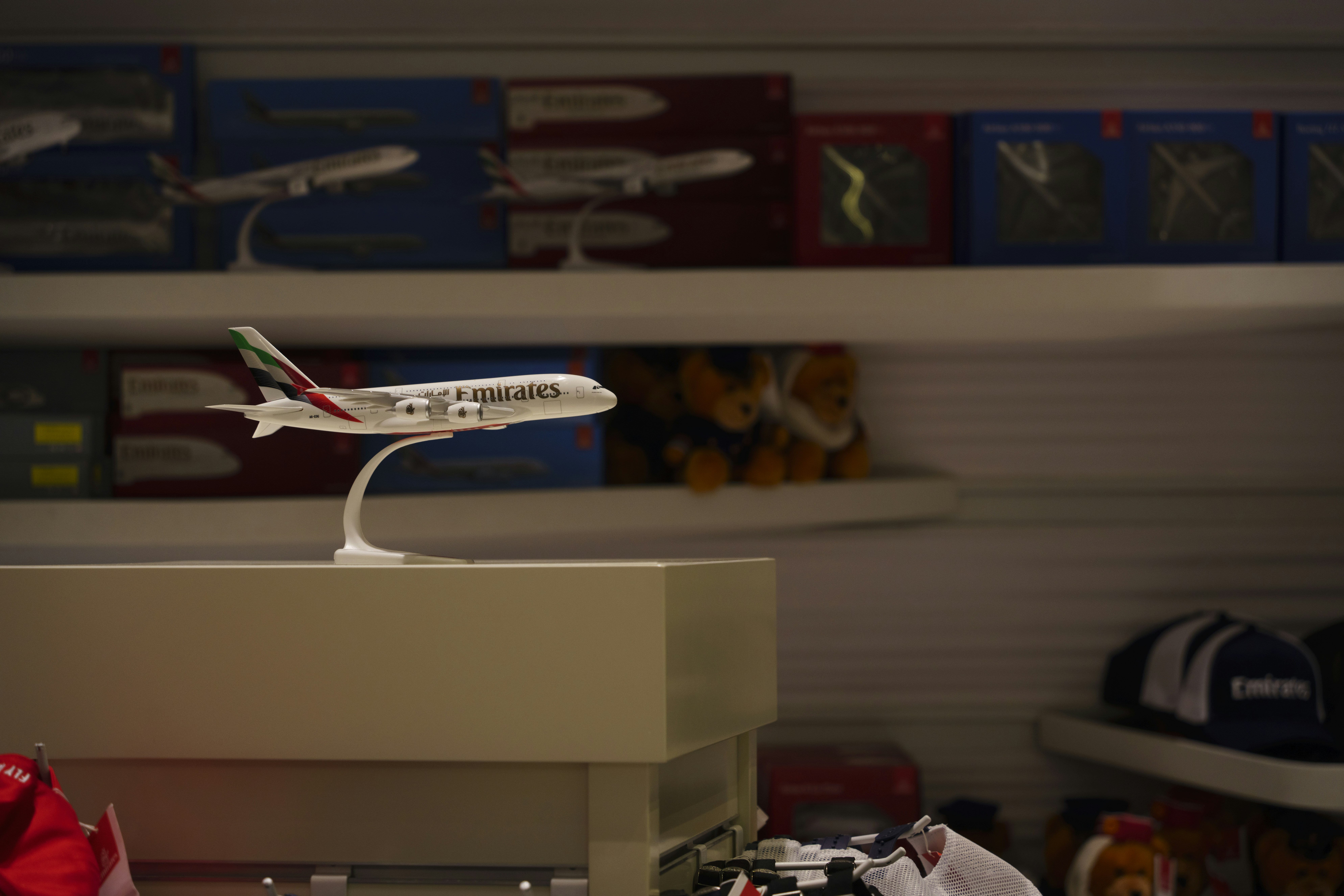 A model airplane on a stand in a store, 