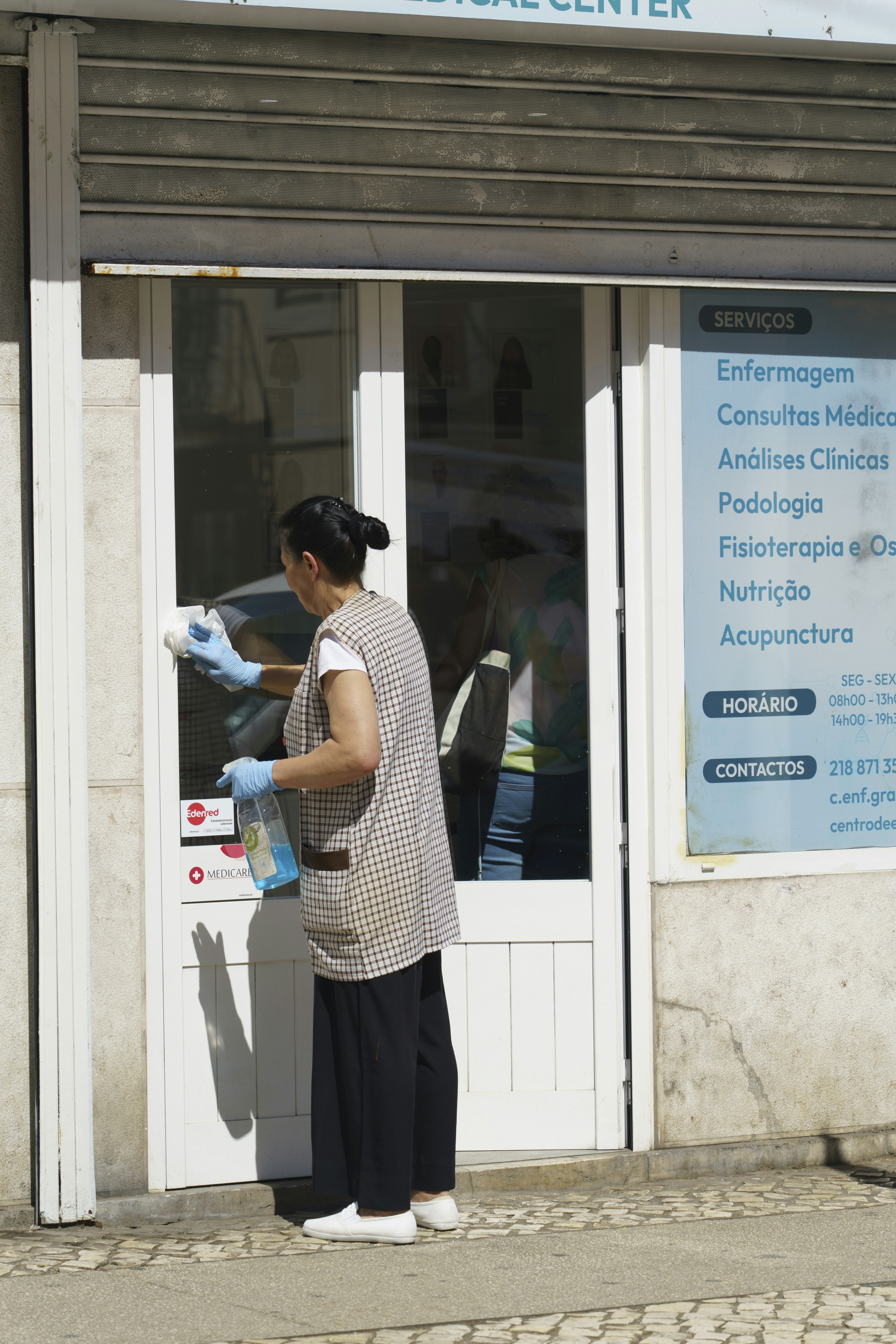 A man standing outside of a medical center