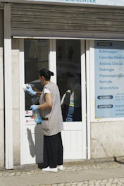 A man standing outside of a medical center