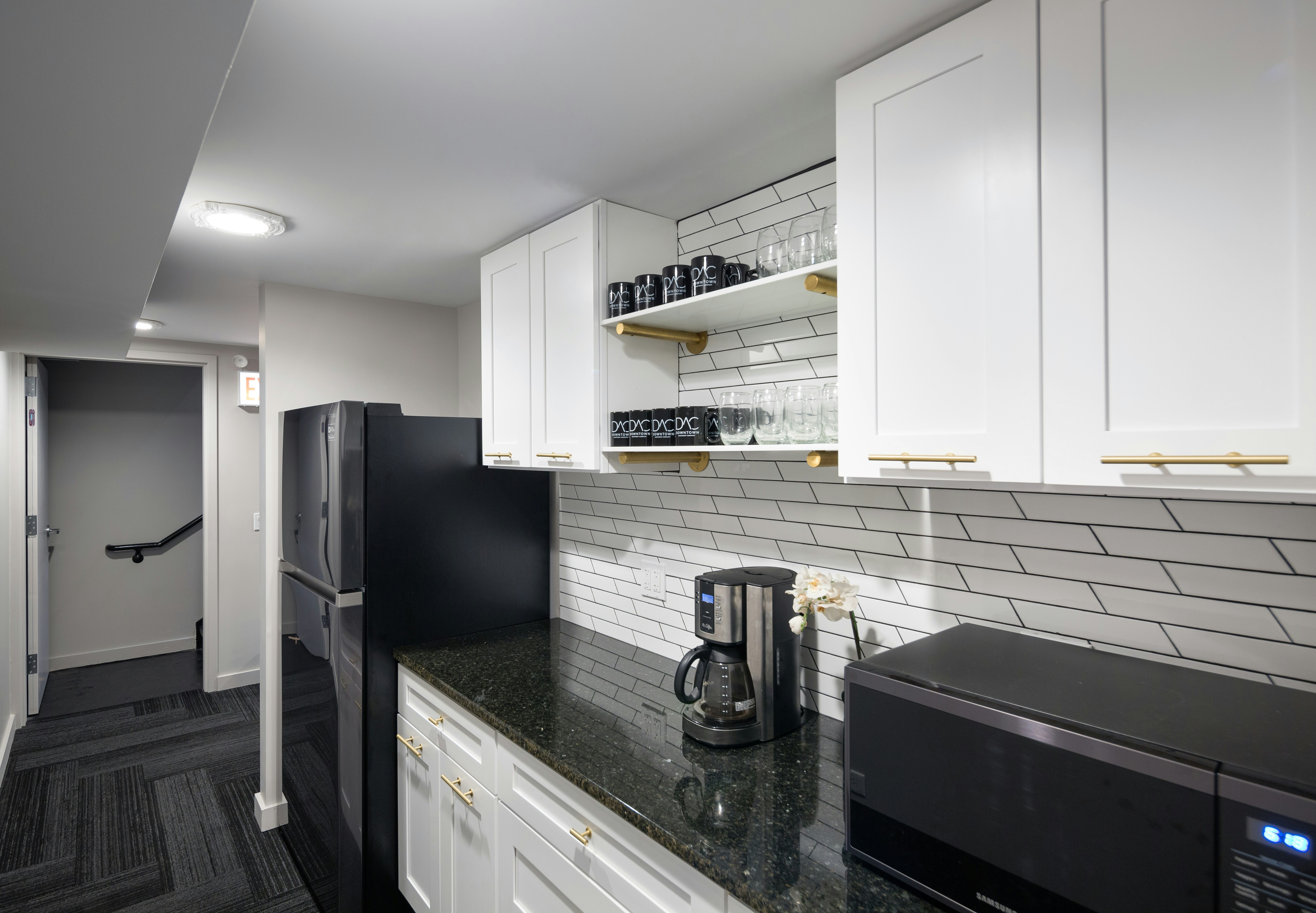 Modern kitchen with large-format floor tile and subway tile backsplash in a Scottsdale home