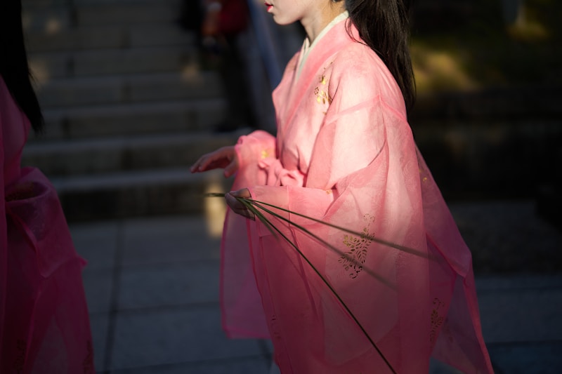 Kyoto lady in pink kimono with umbrella