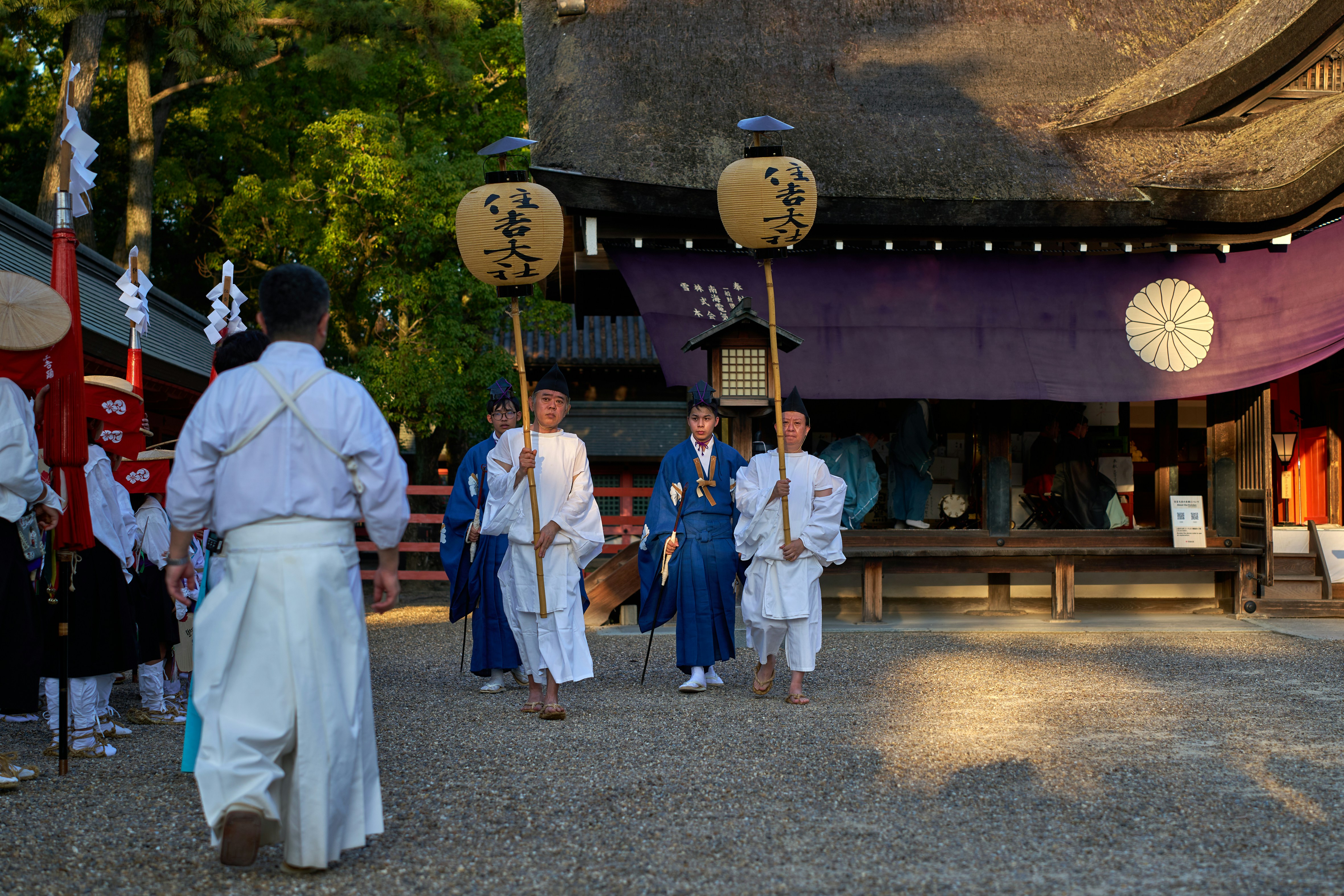 A group of people walking down a street