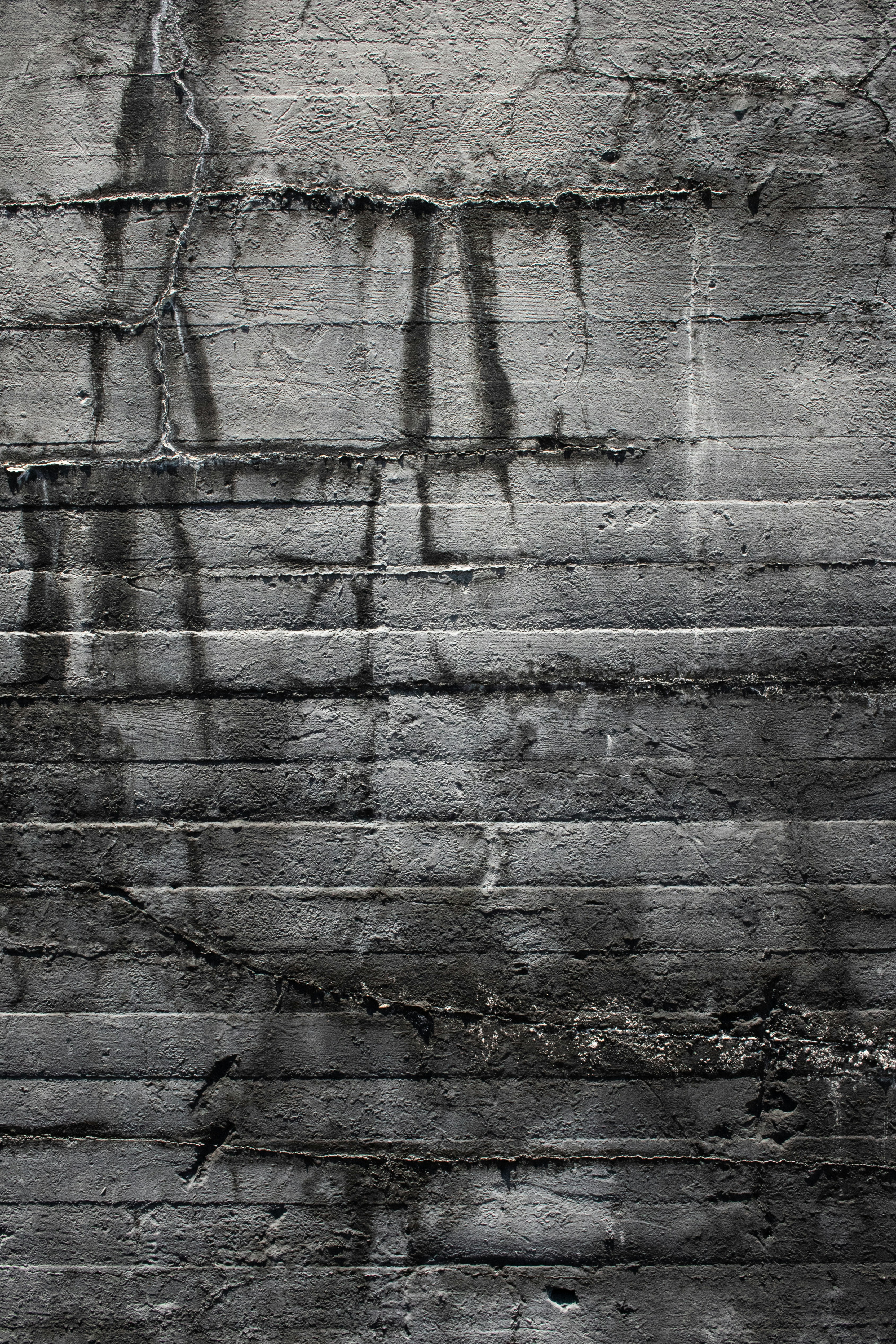 A black and white photo of graffiti on a wall