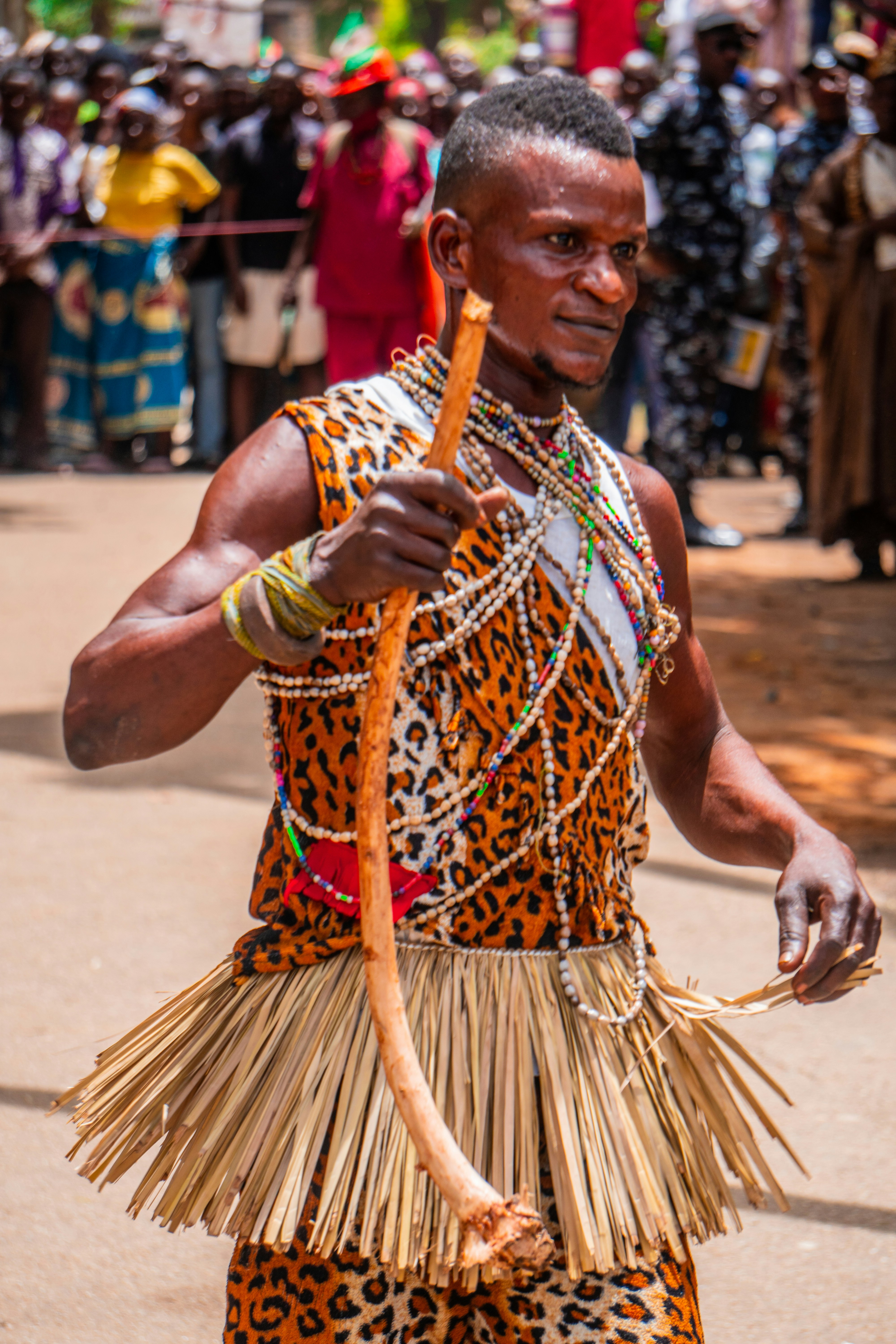 A man in a costume holding a stick