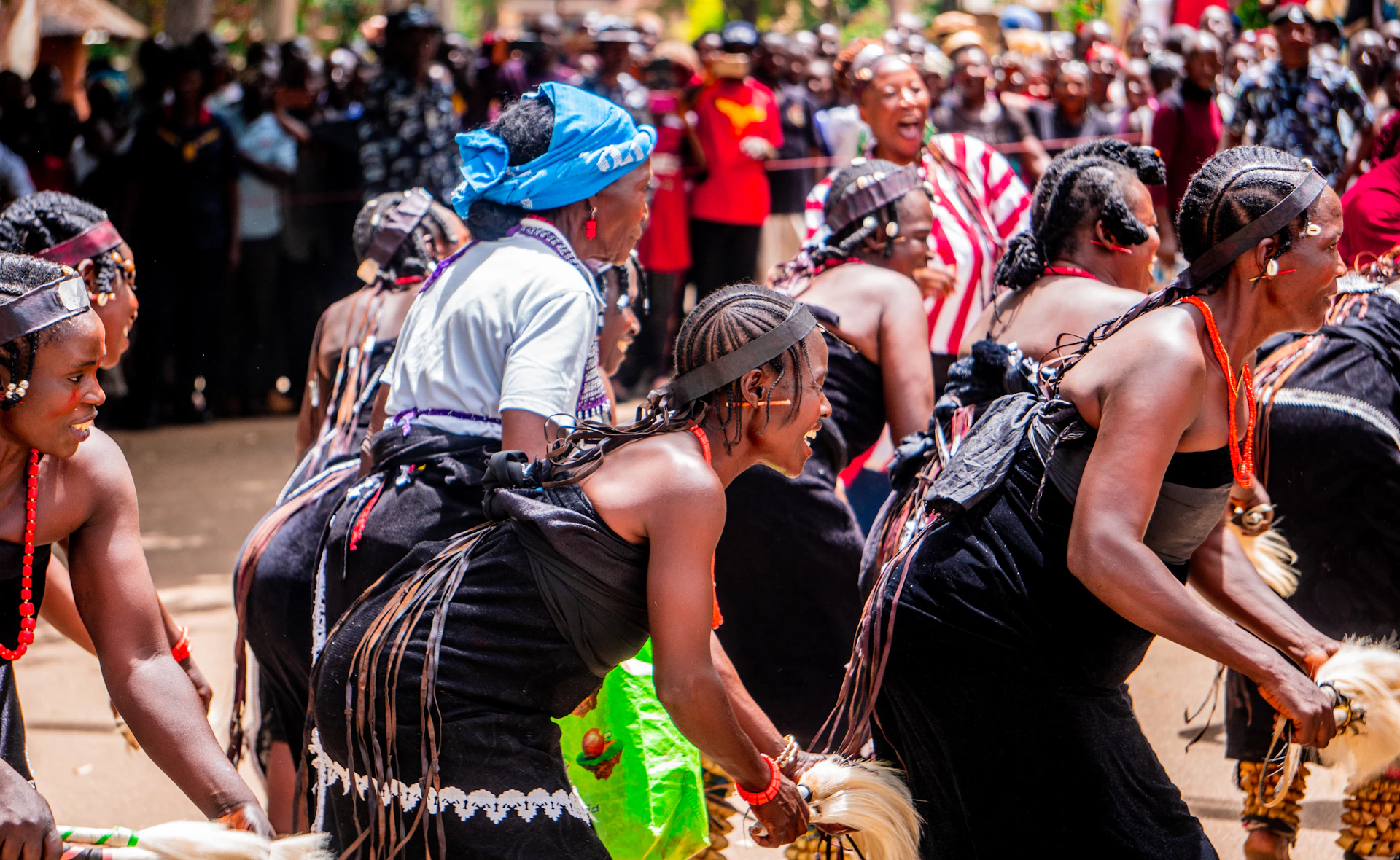 A large group of people standing around each other