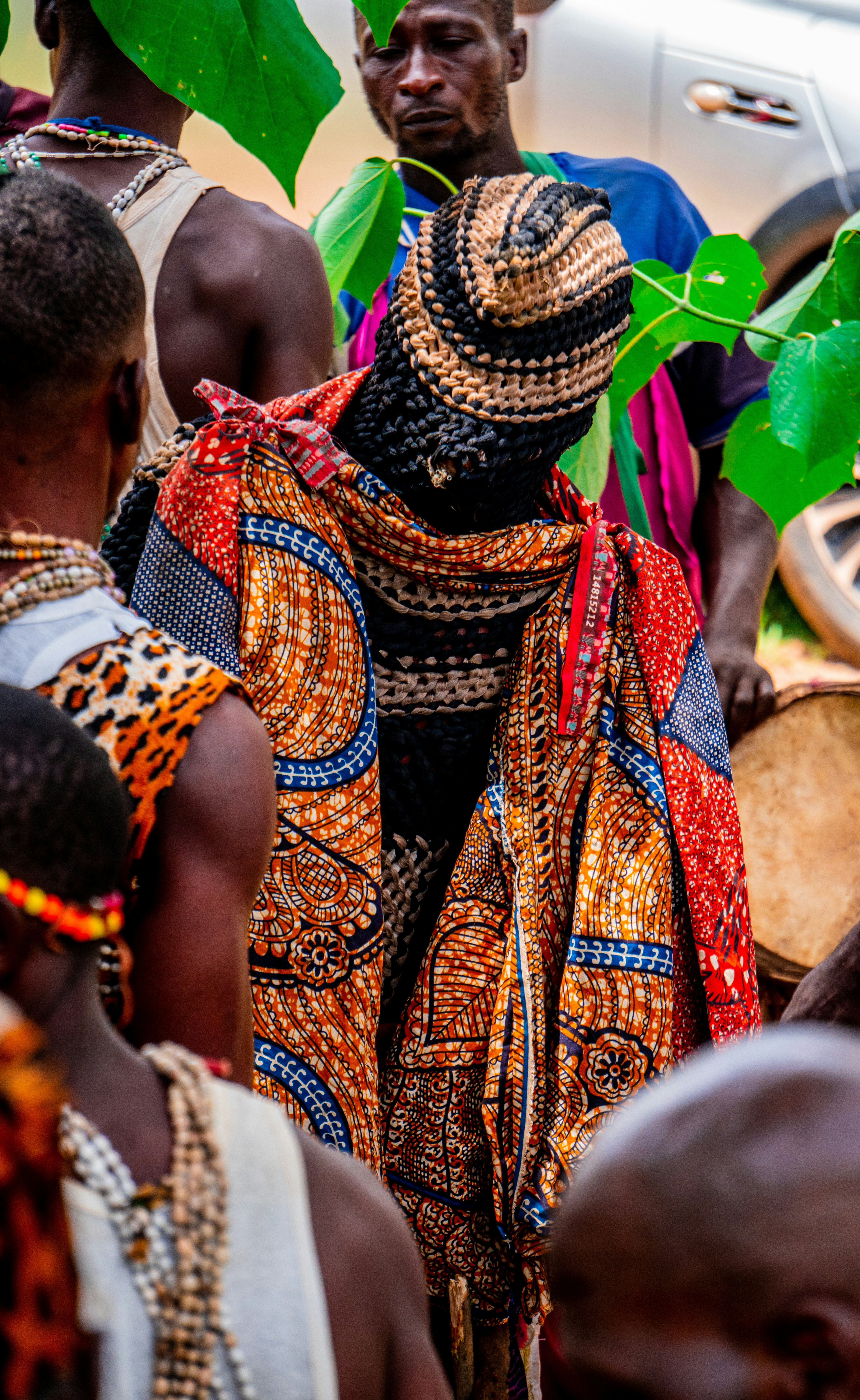 A group of people standing around each other