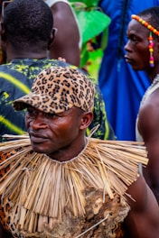 A man in a leopard print shirt and a leopard print hat