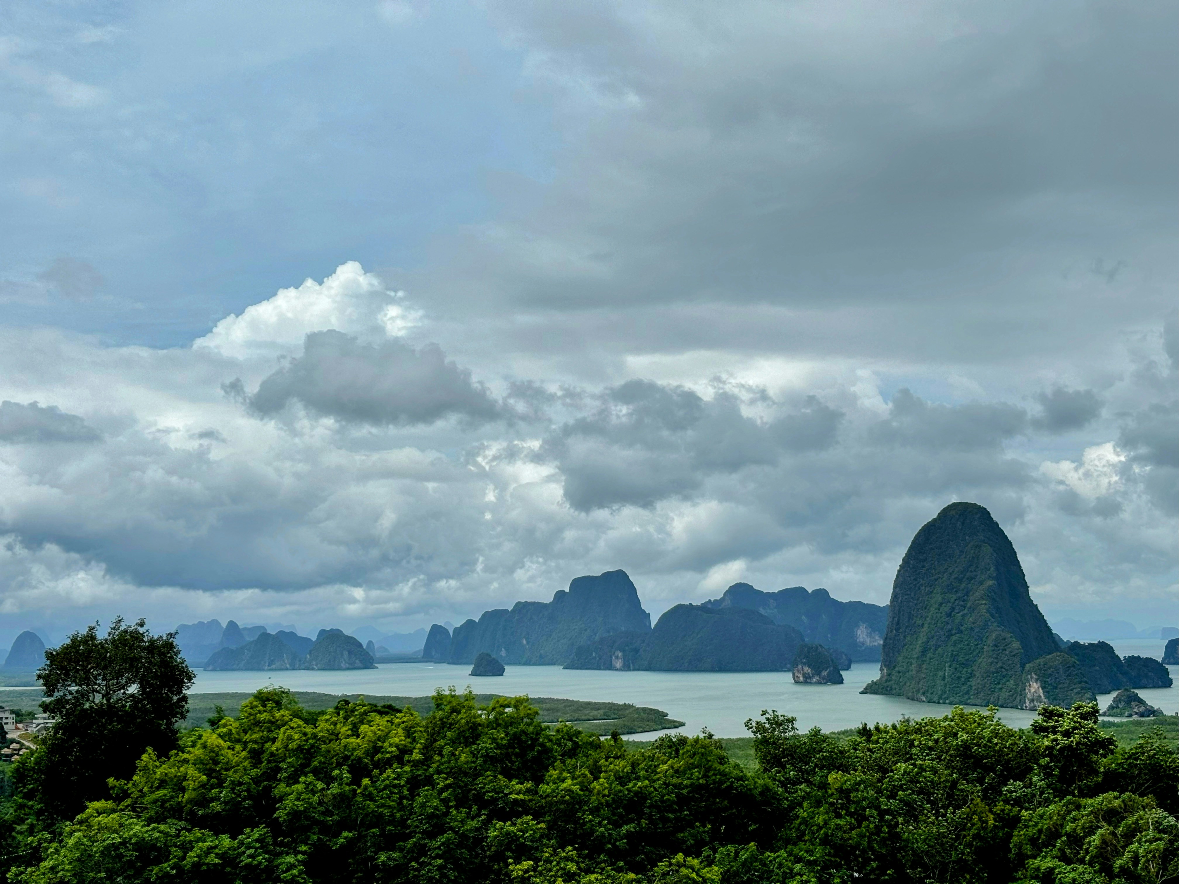 A view of a body of water with mountains in the background