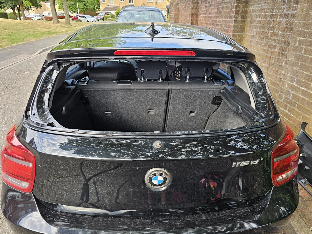 Hatchback with its rear windshield removed, ready for rear glass replacement