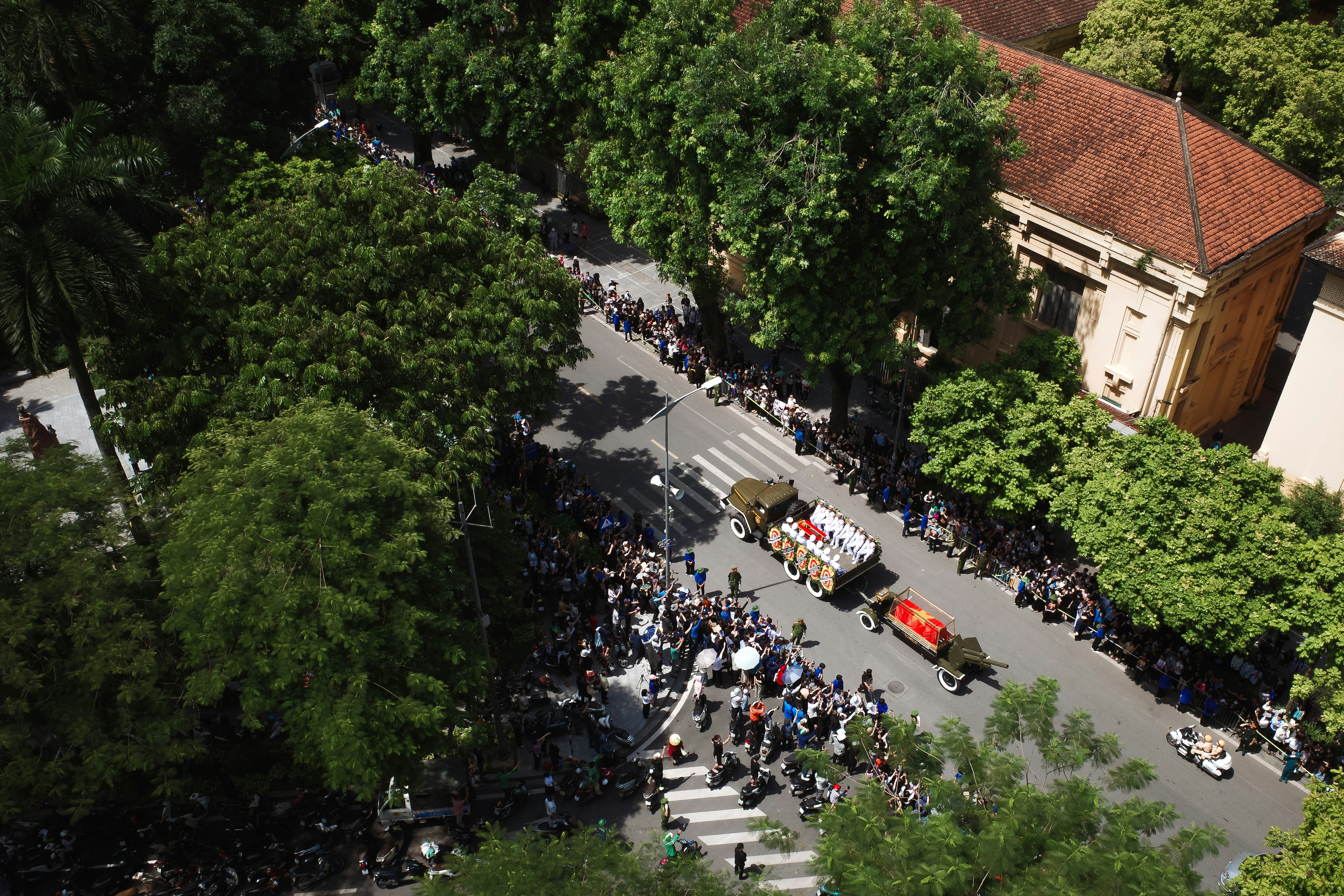 An aerial view of a city street with a bus