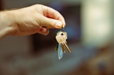 A person holding a bunch of keys in their hand