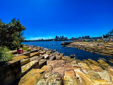 A large body of water with a bridge in the background