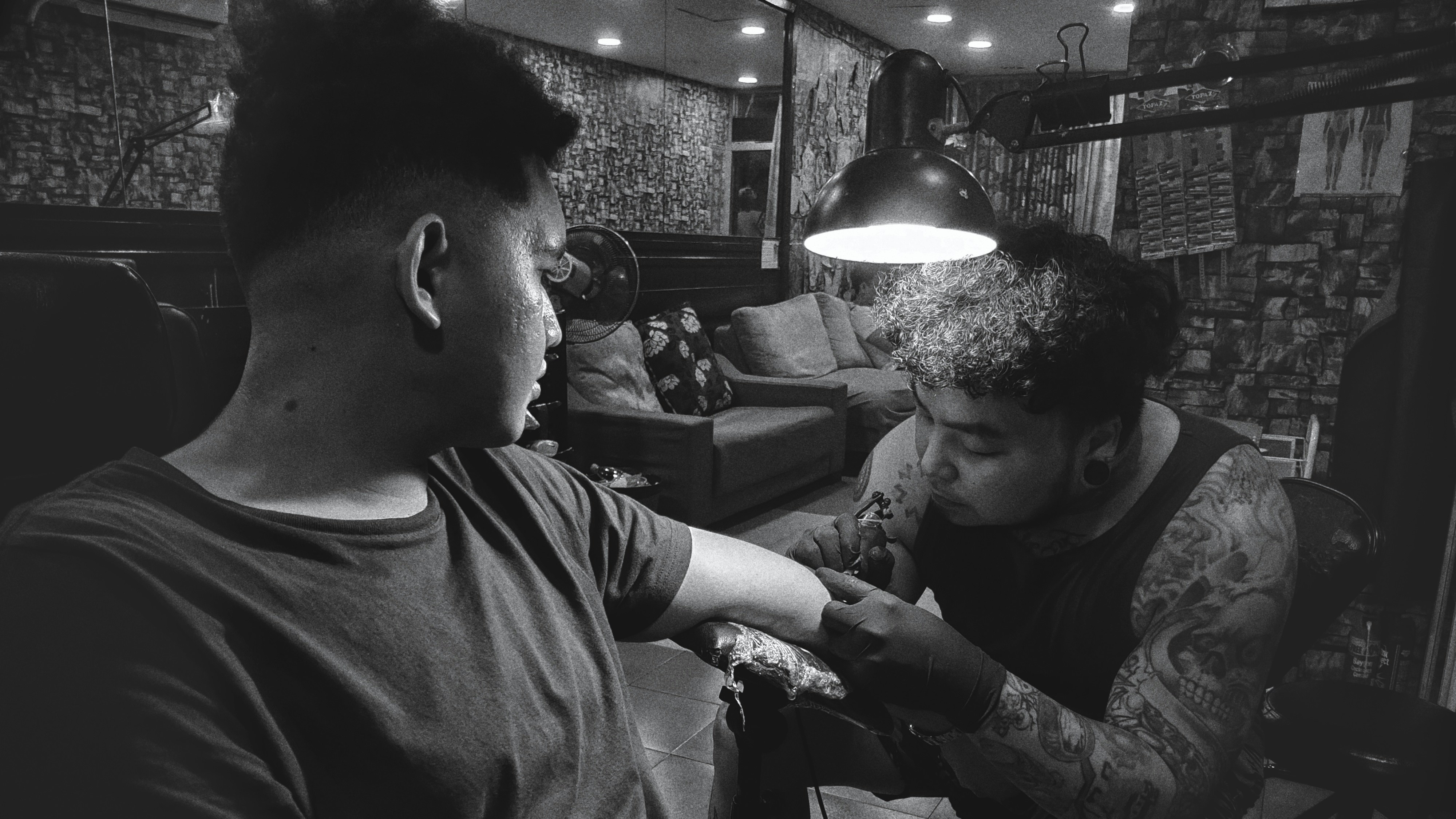 A man getting his hair cut in a barber shop