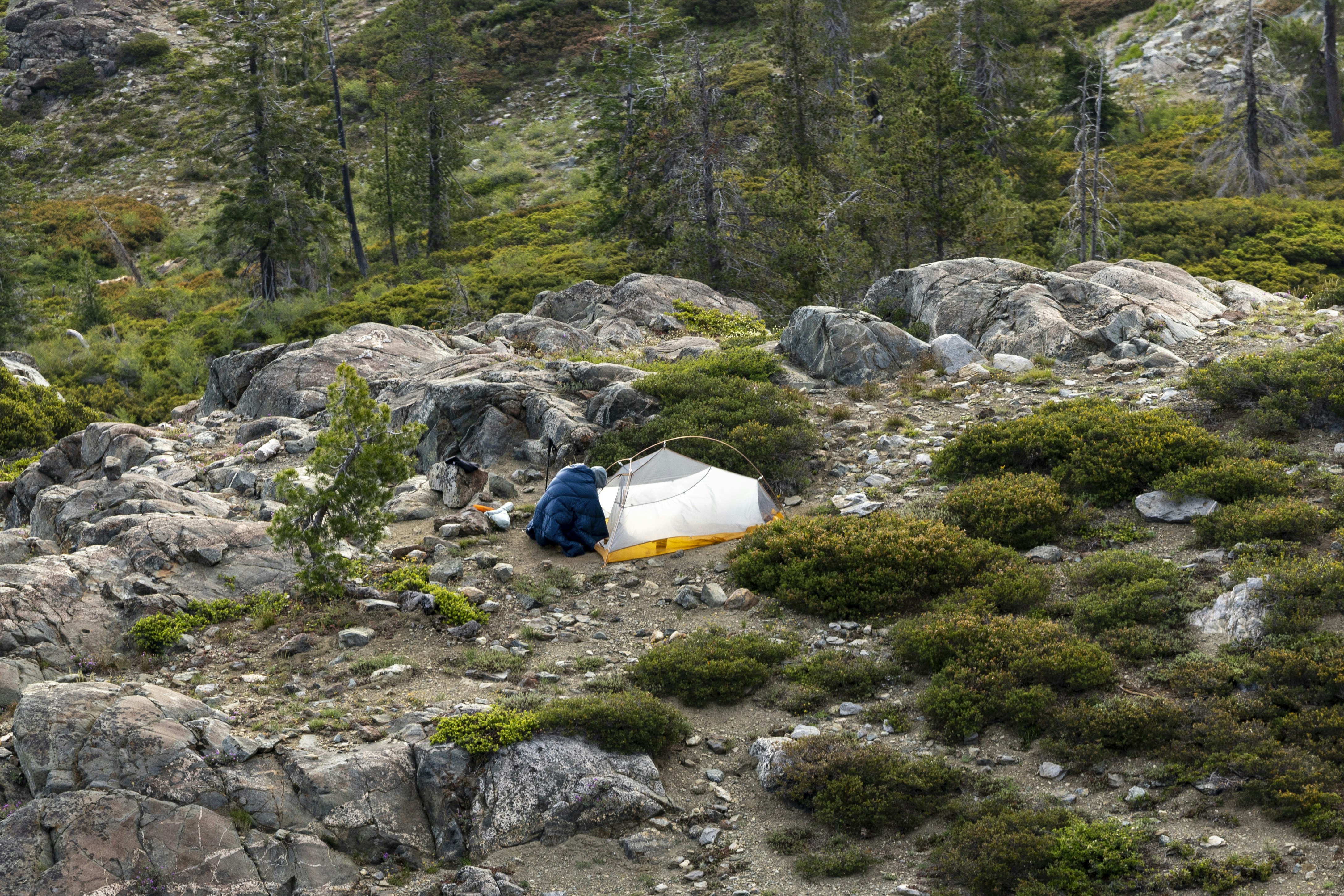 Camping gear backpack forest, Compressed sleeping bag, Mountain hiking equipment, Outdoor adventure gear, ilustrasi artikel The Best Compression Sacks for Packing Sleeping Bags: Save Space and Travel Light 9