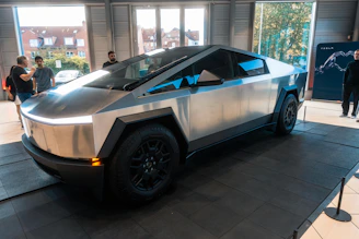 A futuristic car on display in a building